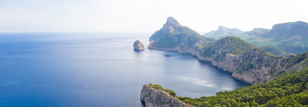 Sail there from Barcelona, it is the closer balearic island